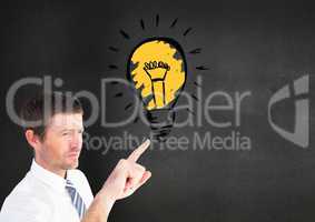 Digital composite image of businessman touching light blub