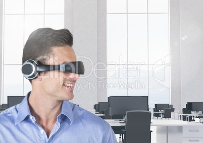 Smiling businessman using virtual reality headset in office
