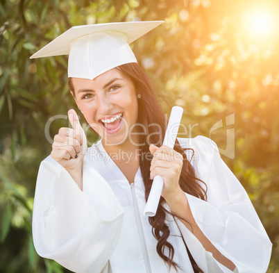 Graduating Mixed Race Girl In Cap and Gown with Diploma