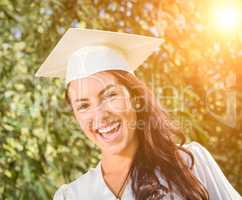 Happy Graduating Mixed Race Girl In Cap and Gown
