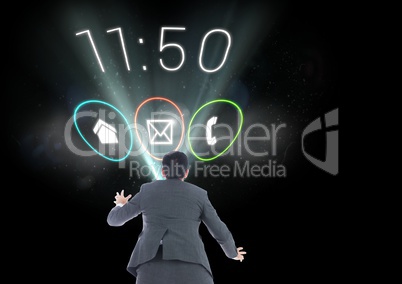 Digital composite image of a businessman with applications icons