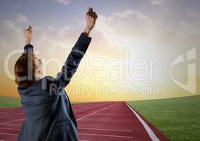 Digital composite image of a businesswoman winning the race