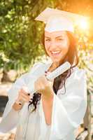 Graduating Mixed Race Girl In Cap and Gown with Diploma