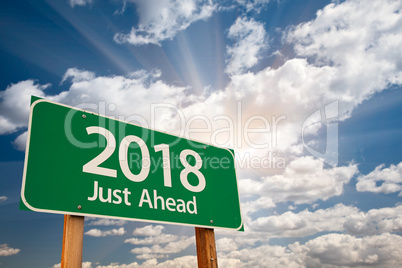 2018 Green Road Sign Over Clouds