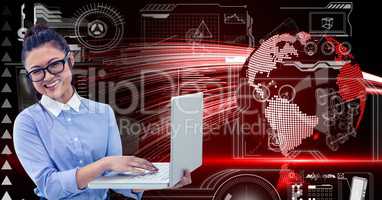 Businesswoman using laptop against digitally composite background