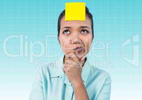 Thoughtful businesswoman with blank yellow sticky note on forehead
