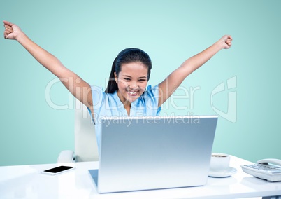 Excited woman looking at laptop