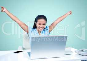 Excited woman looking at laptop