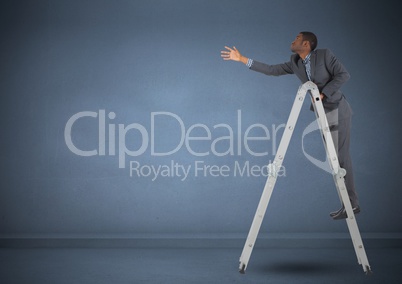 Businessman on ladder stretching his hand to reach