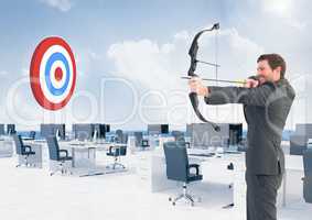 Businessman aiming at target with bow and arrow