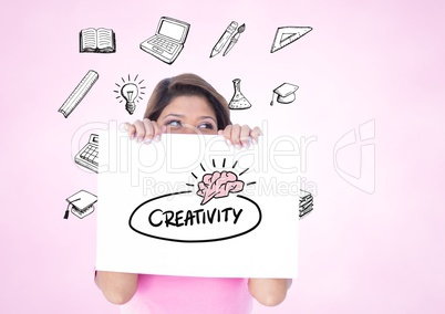 Woman holding a card showing creativity text