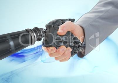 Business man shaking hands with robot