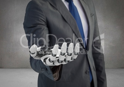 Business man with robot hand in grey background
