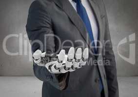 Business man with robot hand in grey background