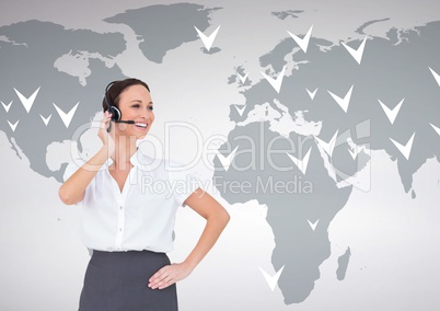 Businesswoman talking on headset with world map in background