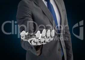 Businessman with robot hand  against blue background
