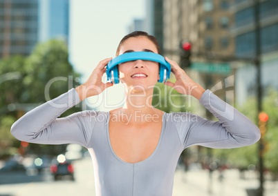 Woman using virtual reality glasses against city in the background