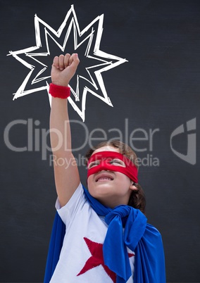 Girl in superhero costume pretending to fly against black background