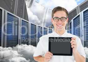 Man holding digital tablet against database server systems in sky