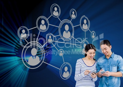 Young couple using smartphone with connection icons