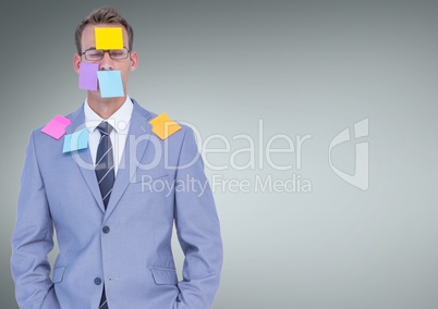 Stressed businessman covered by sticky notes