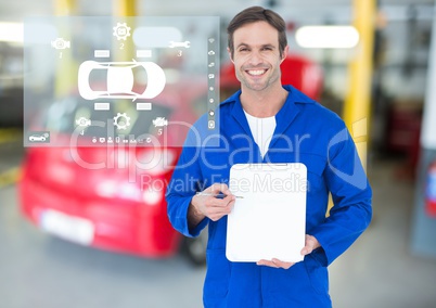 Portrait of smiling mechanic showing clipboard in garage