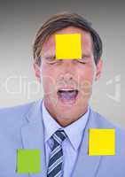 Businessman with blank sticky notes stuck on his face