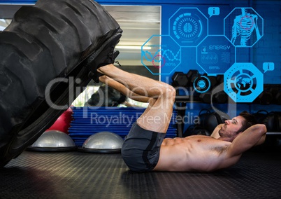 Fit man performing leg press exercise in gym