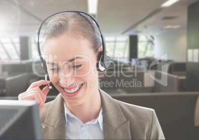 Customer service woman talking on headphone in office