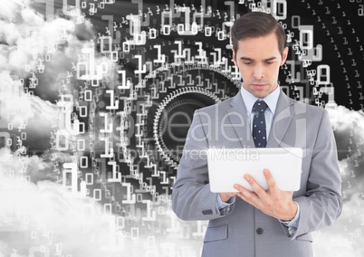 Businessman using digital tablet with binary codes and cloud in background