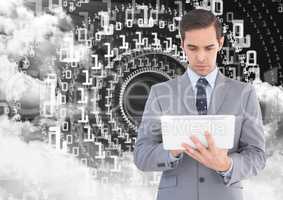 Businessman using digital tablet with binary codes and cloud in background