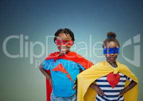 Kids in superhero costume standing with hands on hips