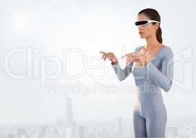 Woman using virtual reality glases against cityscape