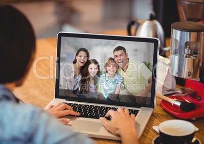 Woman having video call with family on laptop