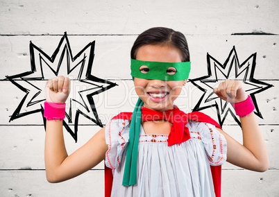 Portrait of kid in red cape and green mask standing with fist
