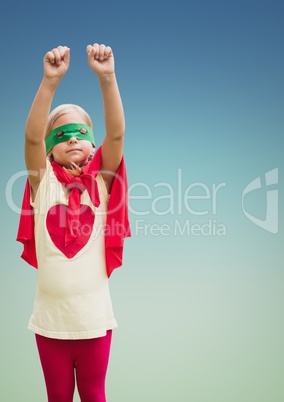 Kid in red cape and mask standing with fist