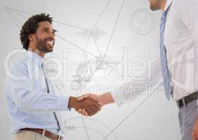Business professionals shaking hands against technology background