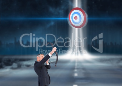 Businessman holding a cross bow and aiming at the target board