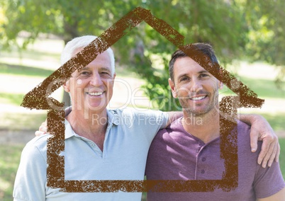 Dad and son standing together in the park with house outline