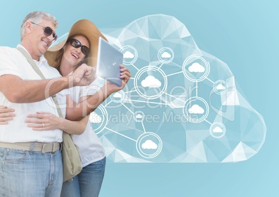 Couple using digital tablet against digitally generated background