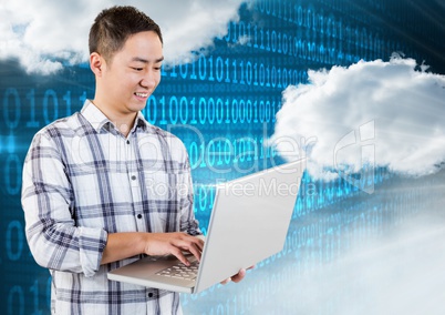 Smiling man using laptop with clouds and binary codes in background