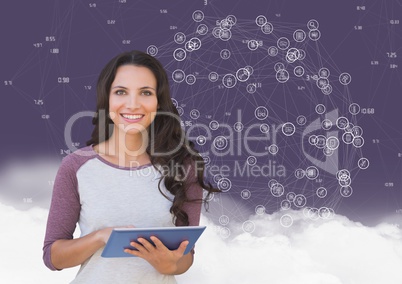 Portrait of a woman holding digital tablet with networking icons and cloud in background