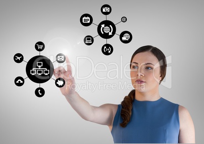 Woman touching applications interface against grey background