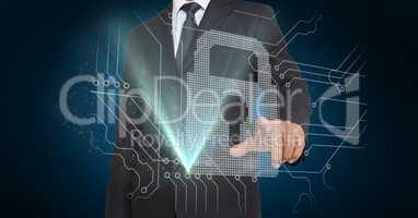 Businessman pretending to touch futuristic lock pad on screen against blue background