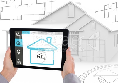 Digital composite image of hand holding a digital tablet with house security concept