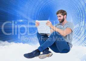 Man using laptop against digitally generated background