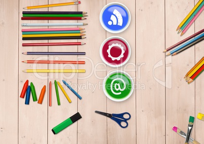 Various icon on color paint with coloring pencil on wooden table