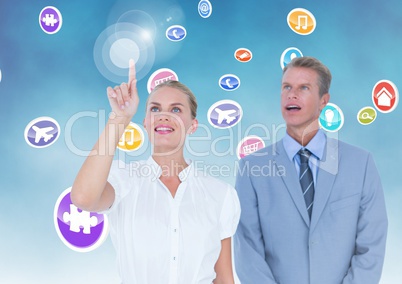 Business executives touching digitally generated application icons