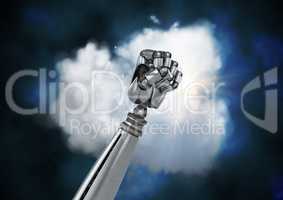 Metal robotic fist against cloud