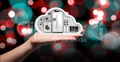 Hand holding a cloud with electronic appliances